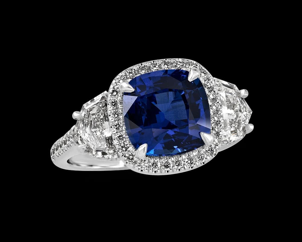 The Alexia Sapphire Halo Three Stone Ring