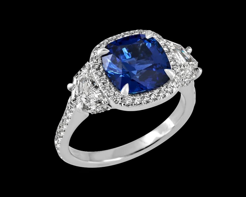 The Alexia Sapphire Halo Three Stone Ring